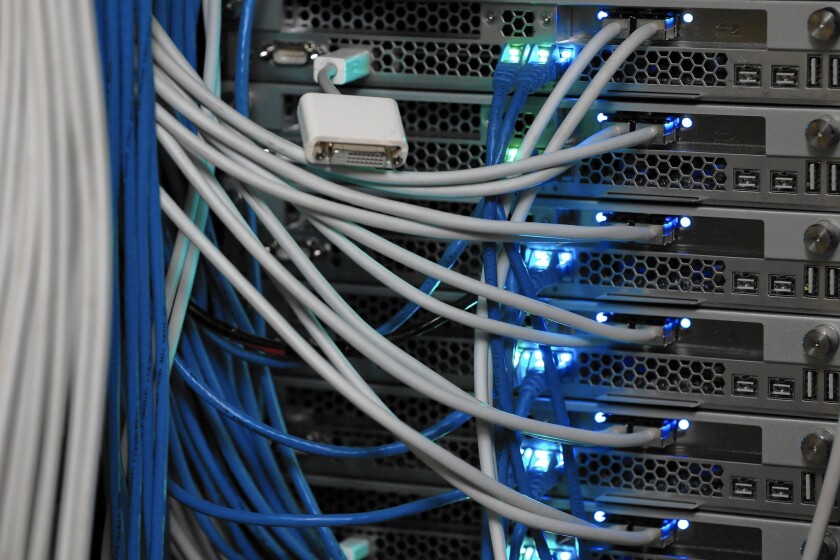 Pesident Obama called for the Internet to be regulated like any other public utility. Above, network cables are plugged in a server room in New York City.