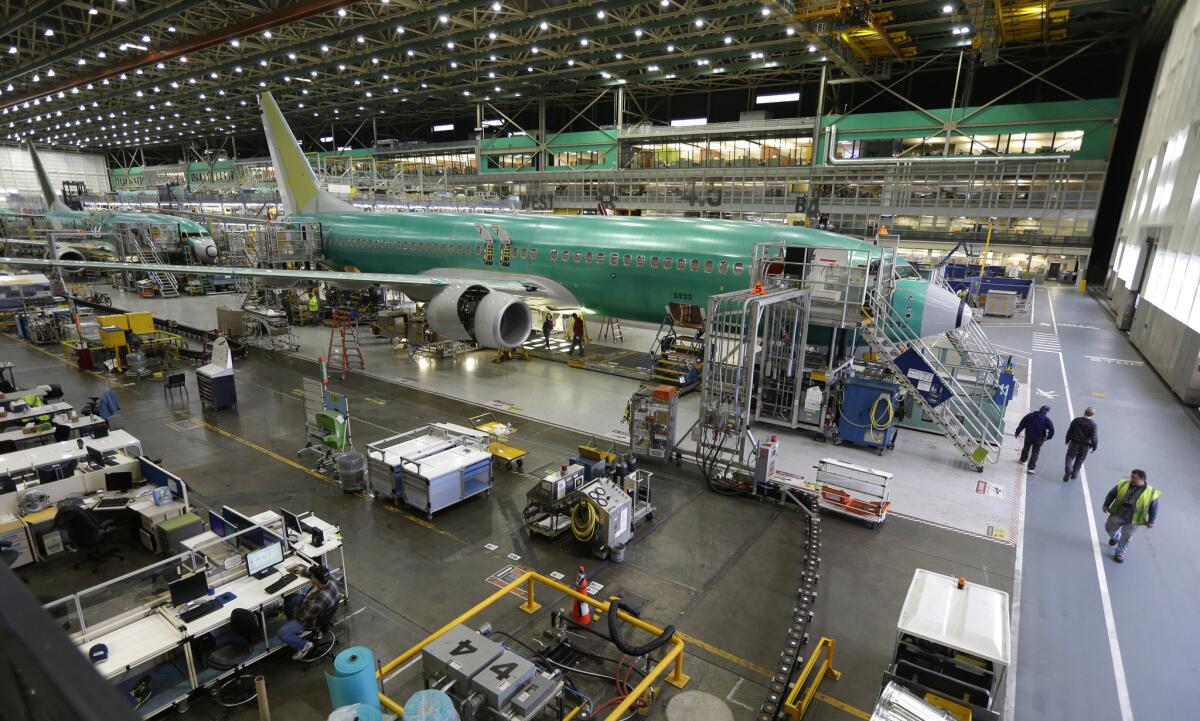 Boeing airplanes are on the assembly line in Renton, Wash., in 2014. Reduced expectations for sales and capital spending over the next six months pushed down the quarterly economic outlook index from the Business Roundtable, a trade association of CEOs of the largest U.S. corporations.