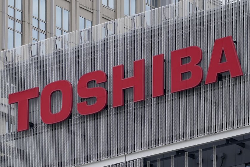 FILE - The logo of Toshiba Corp. is seen at a company's building in Kawasaki near Tokyo, on Feb. 19, 2022. Scandal-embattled Japanese electronics and technology manufacturer Toshiba has accepted a 2 trillion yen ($15 billion) tender offer from Japan Industrial Partners, a buyout fund made up of the nation’s major banks and companies. (AP Photo/Shuji Kajiyama, File)