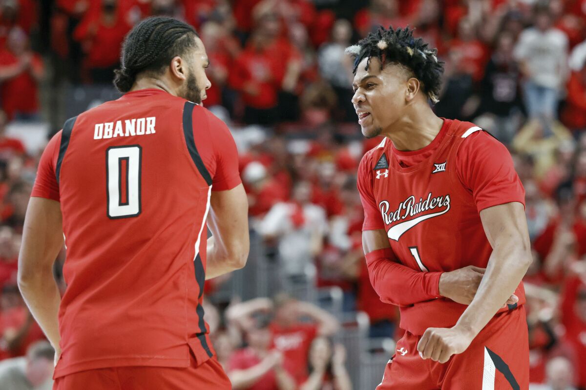 Texas Tech's Terrence Shannon Jr. (1) and Kevin Obanor (0) celebrate a foul call during the second half of an NCAA college basketball game against Iowa State on Tuesday, Jan. 18, 2022, in Lubbock, Texas. (AP Photo/Chase Seabolt)