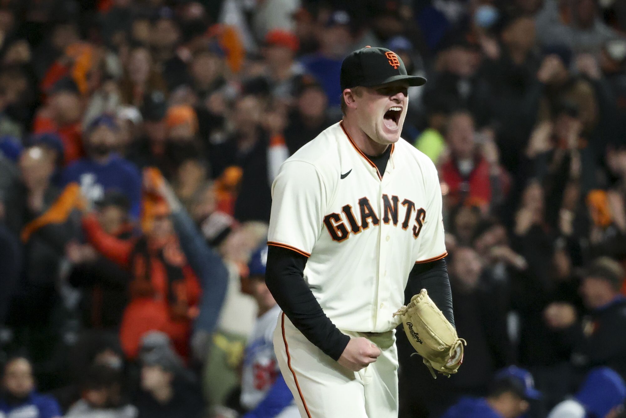 San Francisco Giants starting pitcher Logan Webb reacts after striking out Los Angeles Dodgers' Cody Bellinger
