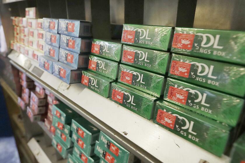 FILE - Menthol cigarettes and other tobacco products are displayed at a store in San Francisco on May 17, 2018. The U.S. government is set to release its long-awaited plan to ban menthol cigarettes and flavored cigars. On Thursday, April 28, 2022, Food and Drug Administration Commissioner Robert Califf previewed the announcement in congressional testimony, saying the proposal would reduce disease and death among smokers and help many quit. (AP Photo/Jeff Chiu, File)