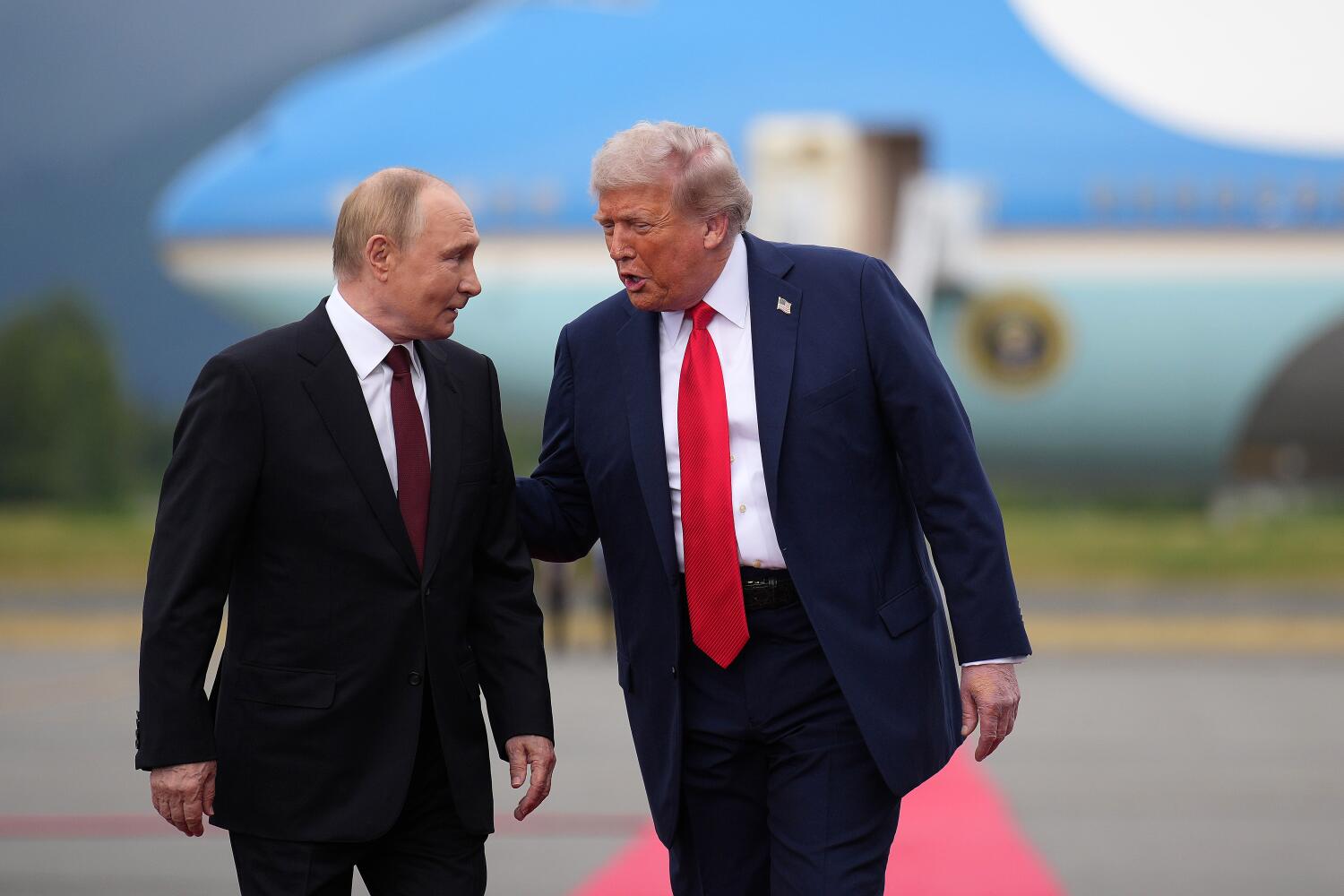 ANCHORAGE, ALASKA - AUGUST 15: U.S. President Donald Trump (R) walks with Russian President Vladimir Putin as they arrives at Joint Base Elmendorf-Richardson on August 15, 2025 in Anchorage, Alaska. The two leaders are meeting for peace talks aimed at ending the war in Ukraine. (Photo by Andrew Harnik/Getty Images)