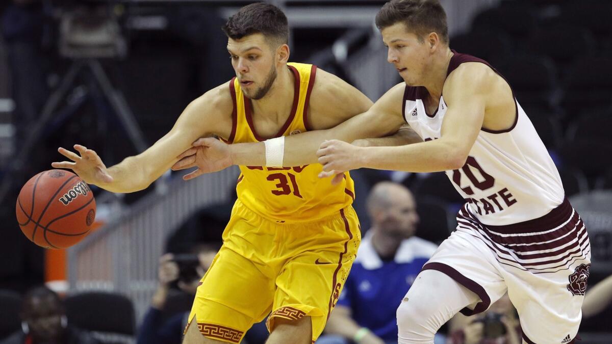 Missouri State's Ryan Kreklow (20) tries to steal the ball from USC's Nick Rakocevic (31) during the first half on Nov. 20 in Kansas City, Mo.