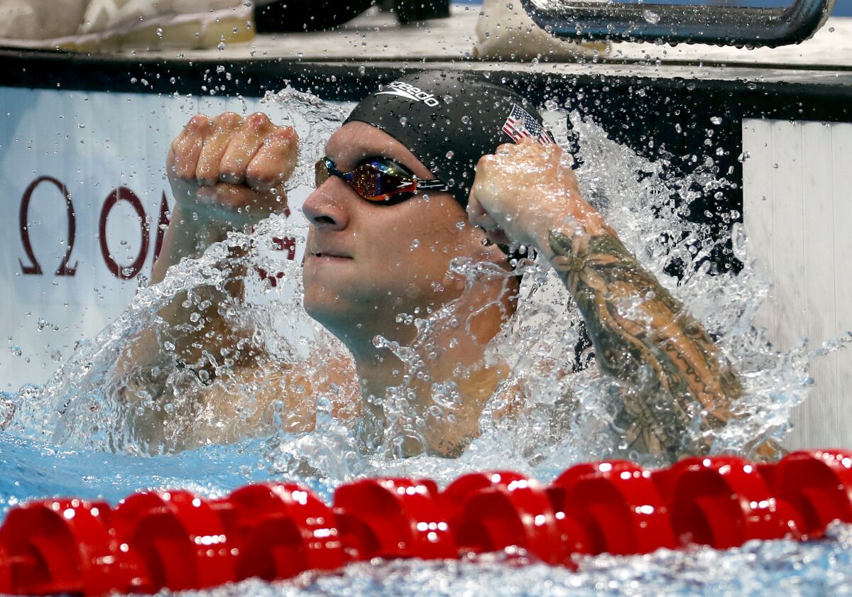 U.S. swimmer Caeleb Dressel celebrates after winning gold in the men's 50-meter freestyle Sunday.