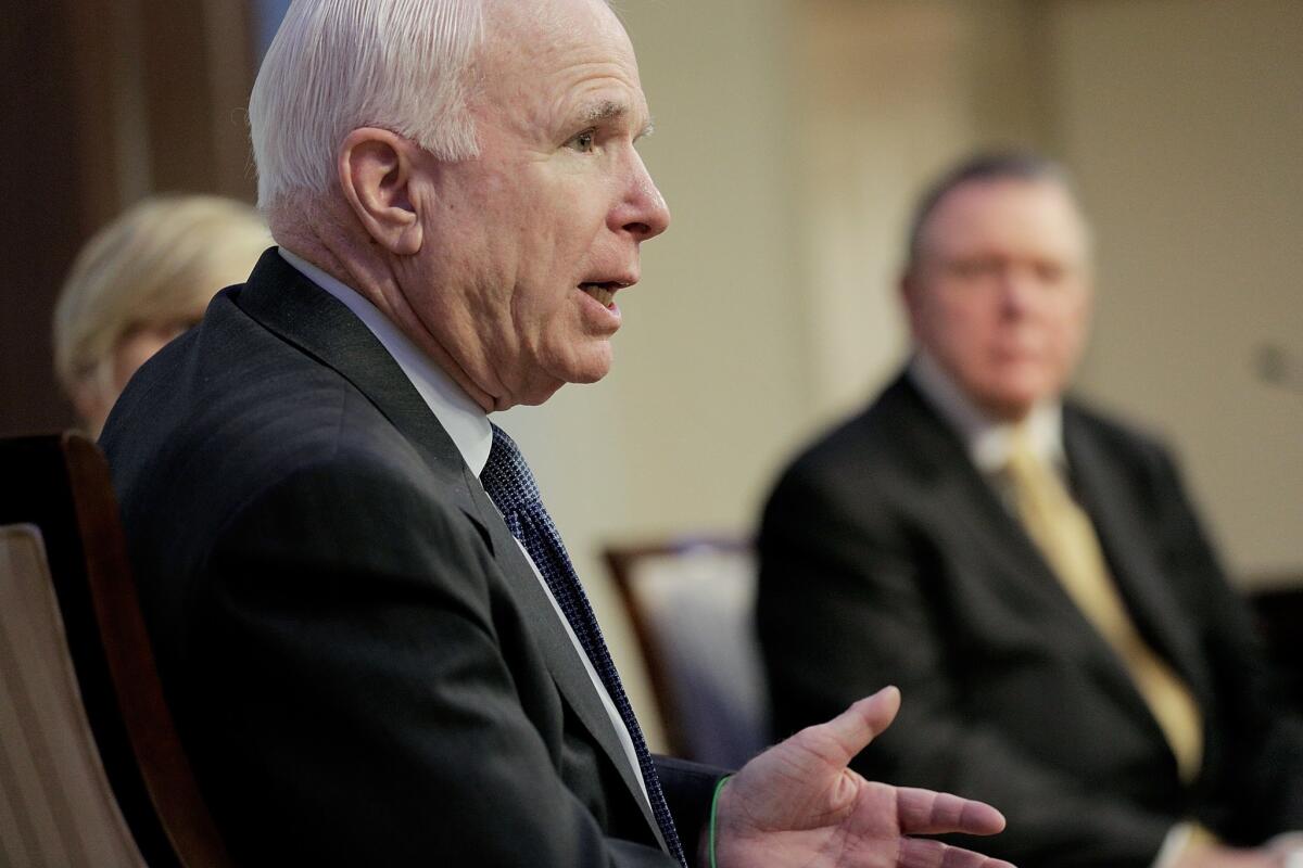 Sen. John McCain (R-Ariz.) participates in a discussion on the unfolding violence in Iraq.
