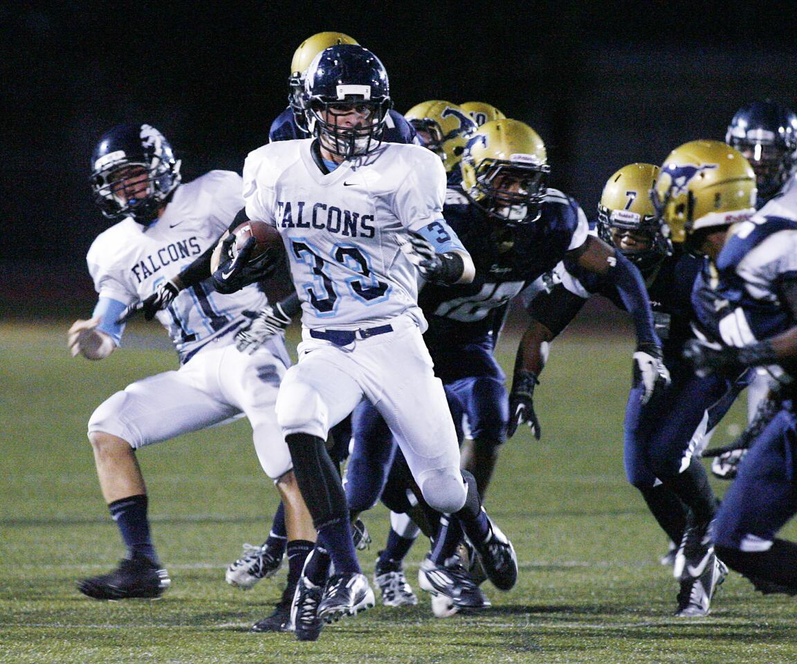 Crescenta Valley's Chad Eggertson runs the ball back during a punt return against Muir in the first quarter in a Pacific League football game at Muir High School in Pasadena on Friday, Setember 21, 2012.