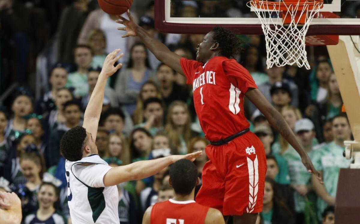 Bol Bol blocks a shot by Chino Hills' LiAngelo Ball as Mater Dei won 83-80 in overtime of the Southern Section Open Division semifinals at USC's Galen Center on Feb. 24, 2017.