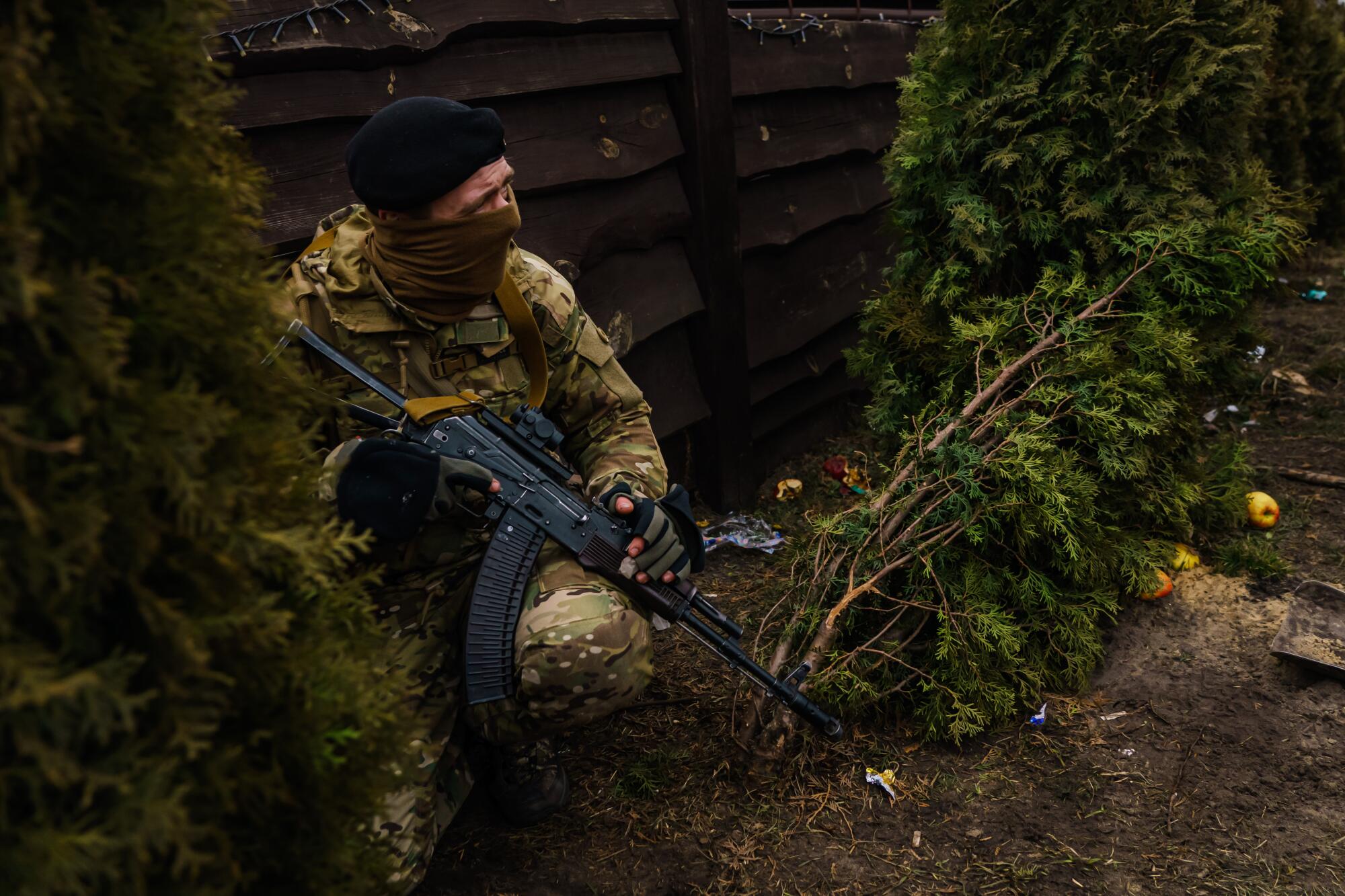 Michael Pestovsky takes cover from incoming Russian artillery fire in Irpin, Ukraine