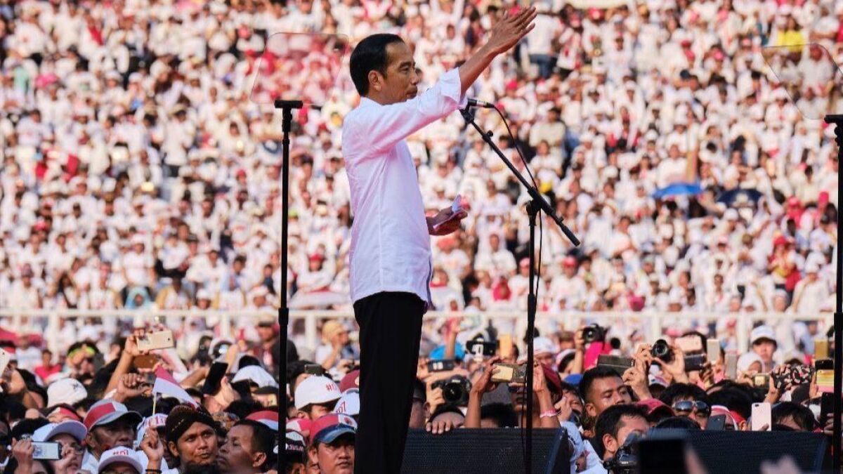 Indonesian President Joko Widodo addresses supporters at a rally at Jakarta's main stadium on April 13, 2019.