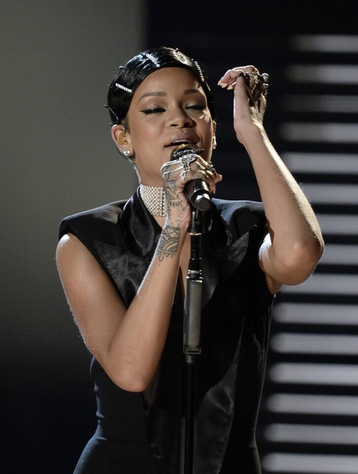Singer Rihanna performs onstage during the 2013 American Music Awards.