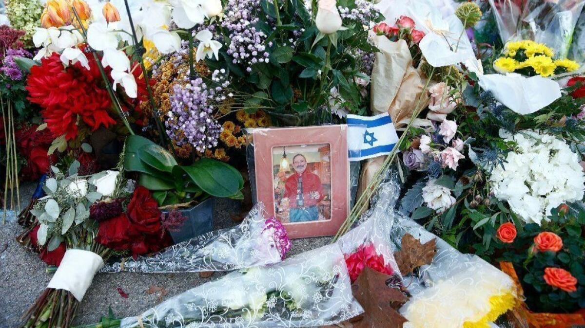 Messages and flowers are left near the Tree of Life Synagogue on Oct. 30, three days after the mass shooting in Pittsburgh.