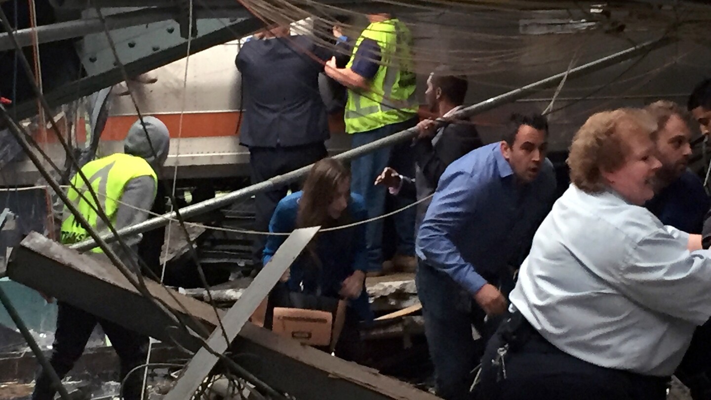 Passengers rush to safety after a NJ Transit train crashed into the platform at the Hoboken, N.J., terminal on Sept. 29, 2016.