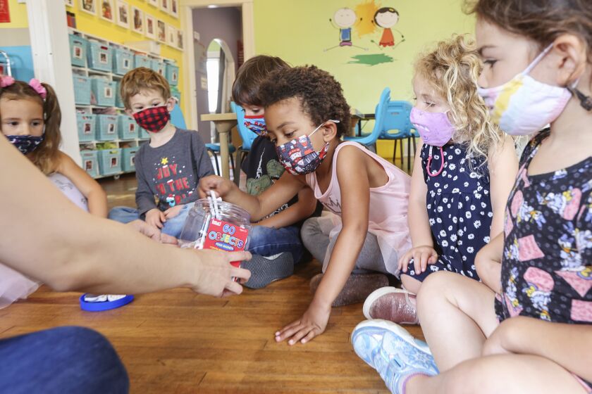 SAN DIEGO, CA - MAY 13: Student Ava Day (right), 4, plays a game with other students at Le Petite Etoile 360 Preschool on Thursday, May 13, 2021 in San Diego, CA. This University Heights preschool is one of over 32,000 daycare centers listed on the site of a local tech startup called Tootris. (Eduardo Contreras / The San Diego Union-Tribune)