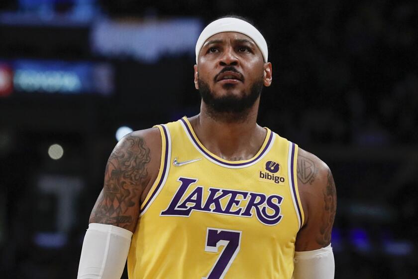 Lakers forward Carmelo Anthony stands on court (7) during a break in the second half the Houston Rockets at Staples Center. 
