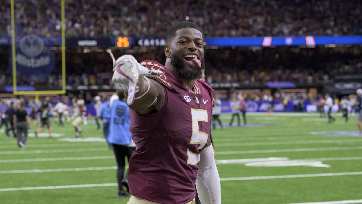 Florida State's Jared Verse (5) celebrates his team's 24-23 victory over LSU.