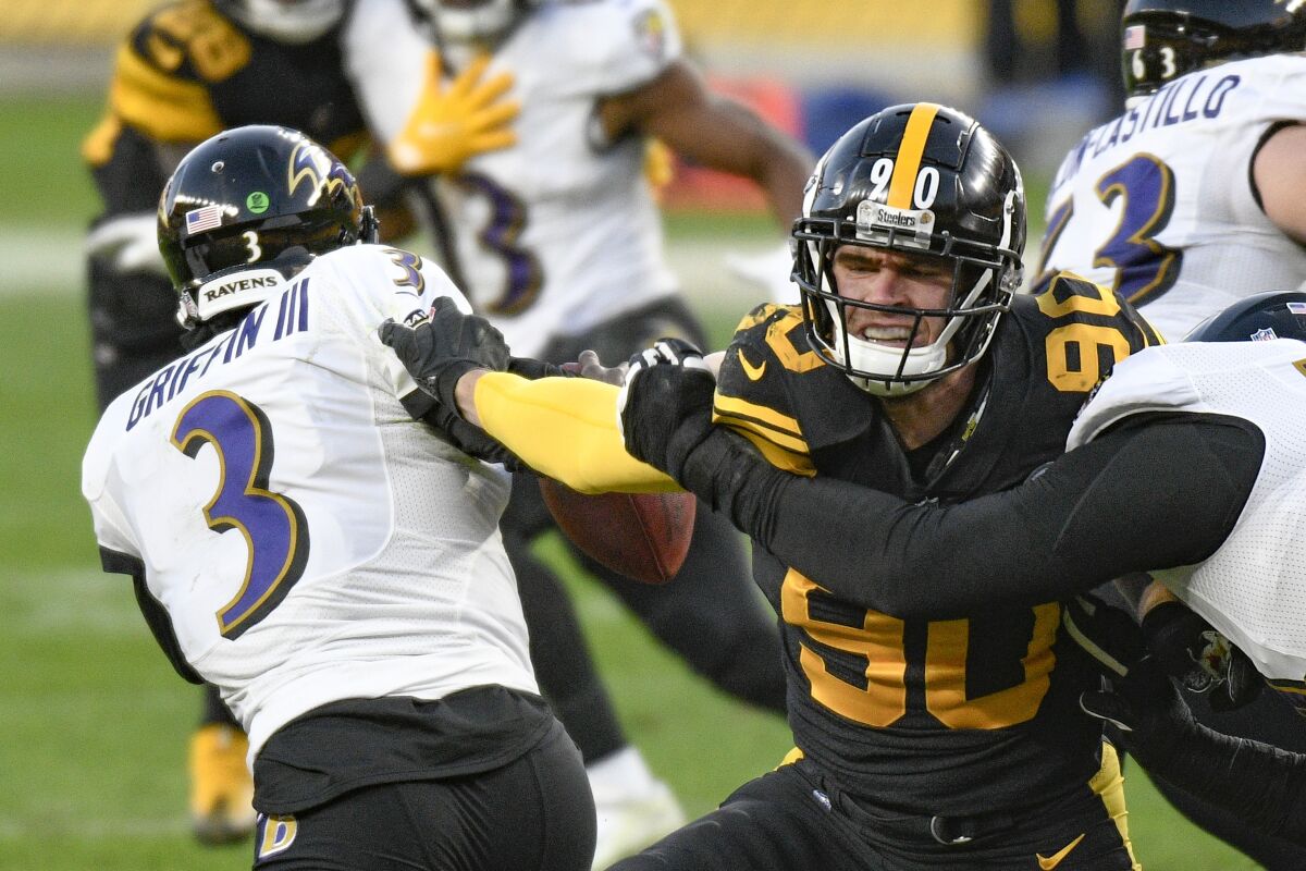Pittsburgh Steelers linebacker T.J. Watt pressures Baltimore quarterback Robert Griffin III on Dec. 2.