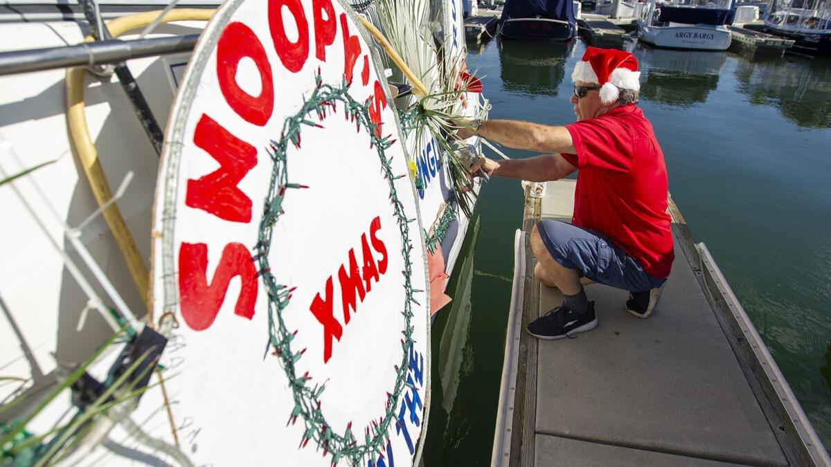 Greg Killingsworth decorates his boat Paradise Found, a 30-foot express cruiser, for the Newport Beach Boat Parade. Killingsworth is an eight-time Newport Beach boat parade award winner.