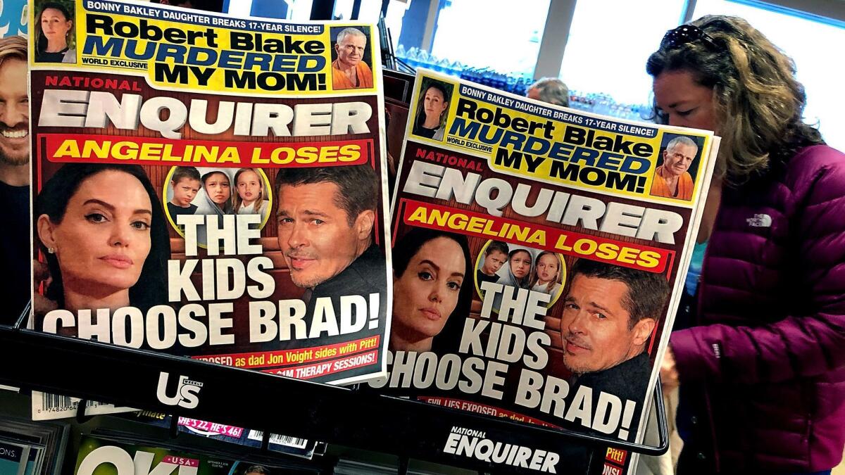 The parent company of the National Enquirer, displayed at a grocery store in San Anselmo, Calif., in 2018, received crucial funding from a hedge fund financed by CalPERS.