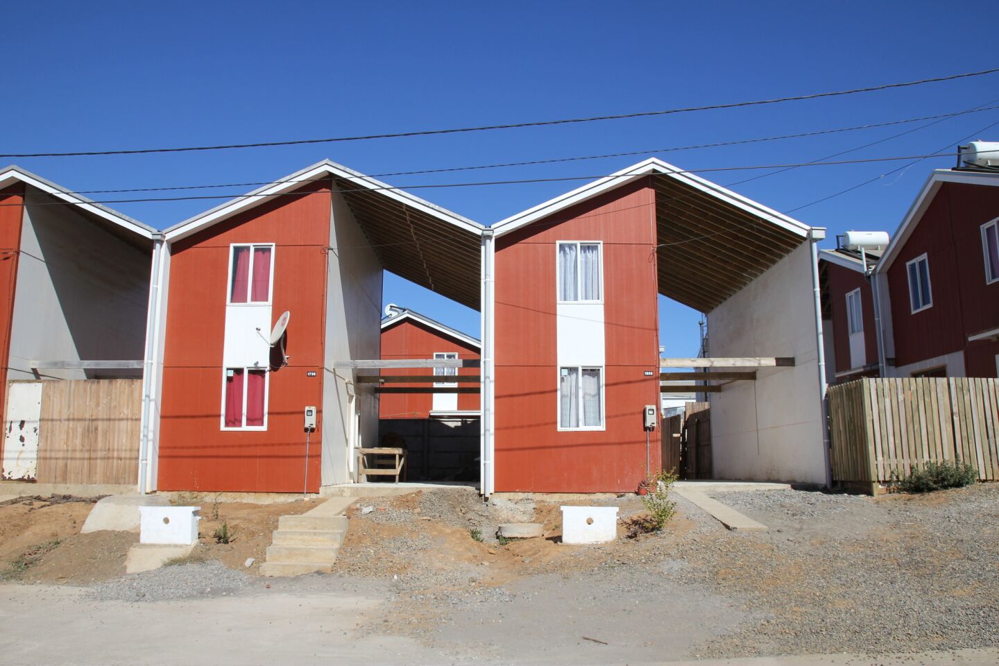 Part of the rebuilding plan involved creating more worker housing. Elemental built some of its signature social housing units: inexpensive half houses that allow the buyer to finish the construction in their own way and on their own schedule.