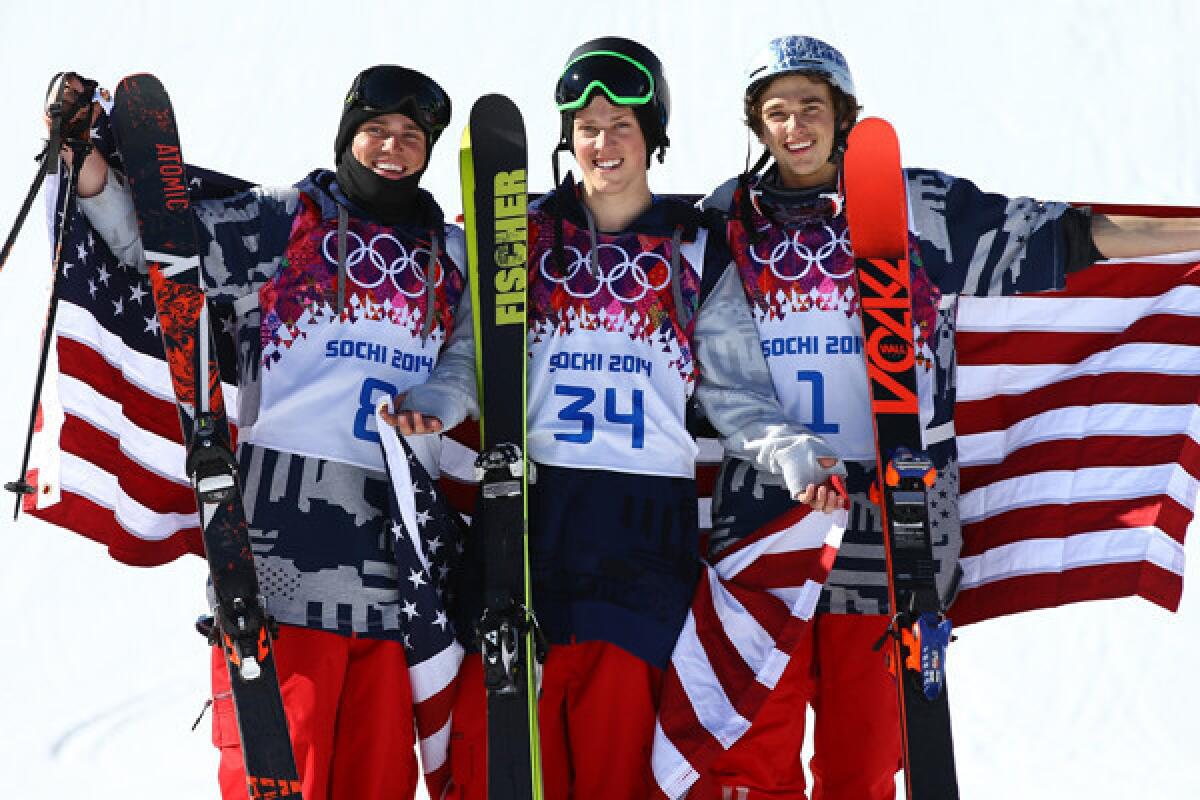Gold medalist Joss Christensen is flanked by U.S. teammates Gus Kenworthy, left, and Nicholas Goepper after sweeping the men's slopestyle skiing competition on Thursday at the Sochi Olympics.