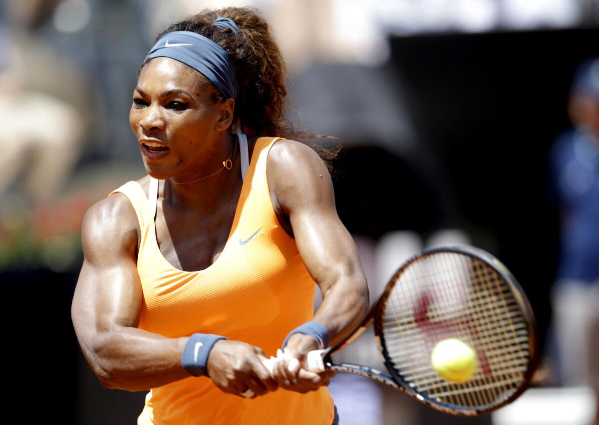 Serena Williams hits a return shot to Simona Halep during their semifinal match.