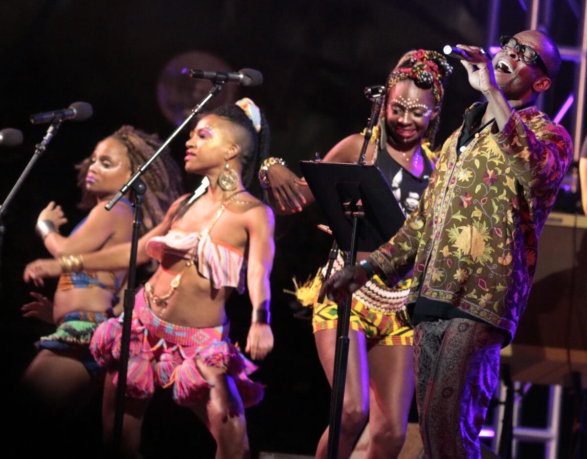 Sahr Ngaujah, right, with background singers during Chop & Quench's performance of Fela Kuti's "The '69 Los Angeles Sessions" at California Plaza.