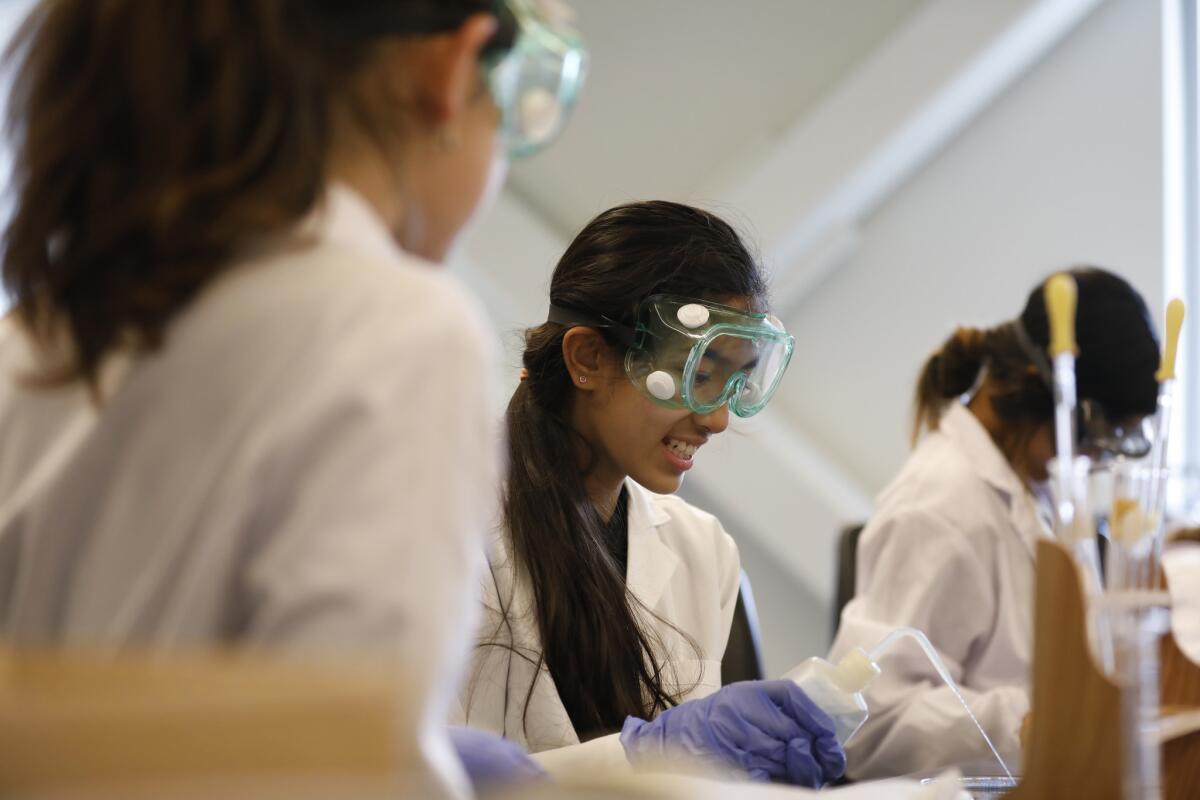 Shanti Raminani works on an experiment in the chemistry lab on campus. (Francine Orr / Los Angeles Times)