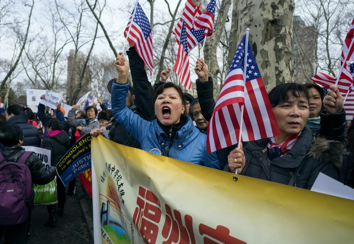 People protest in Brooklyn, N.Y., in support of Peter Liang after his conviction.