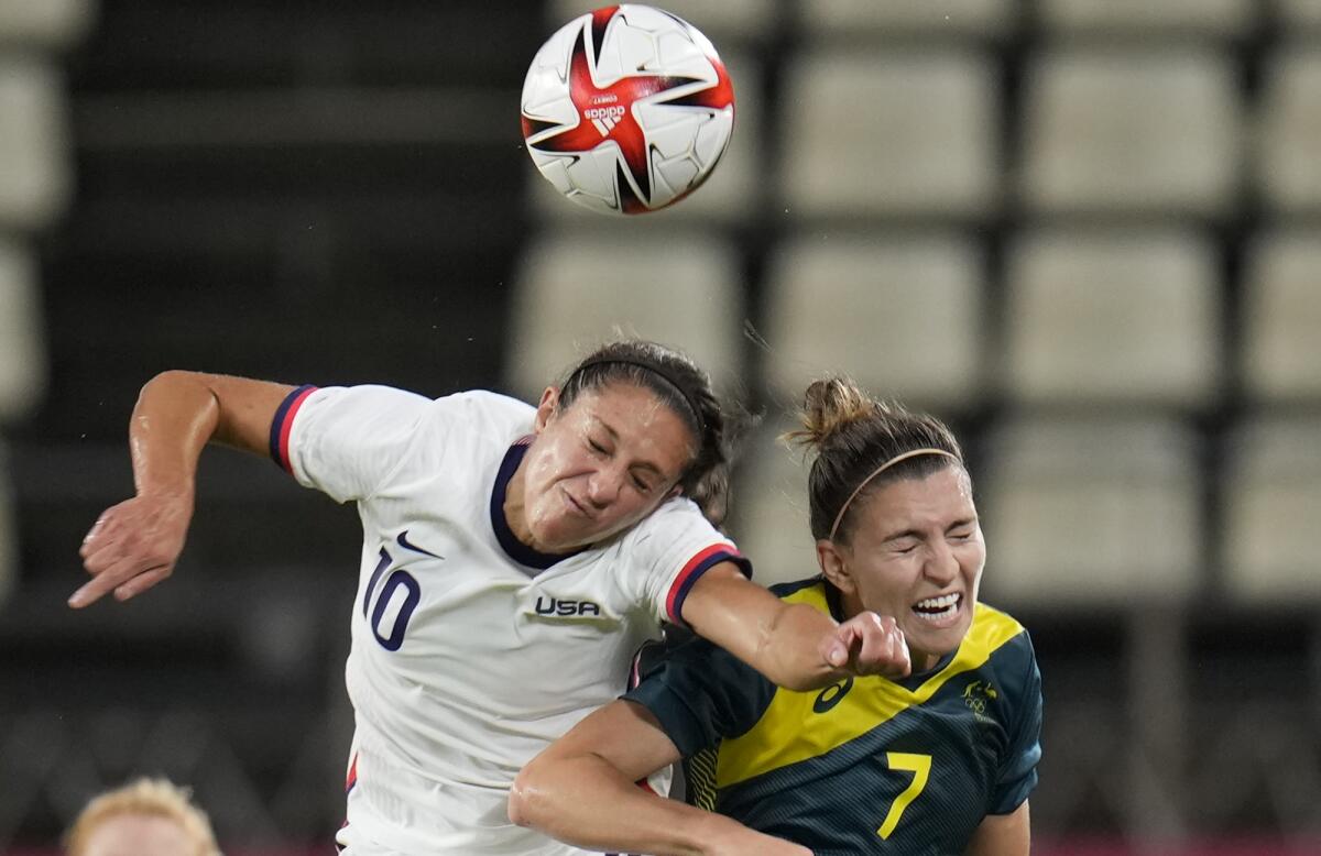 United States' Carli Lloyd, left, and Australia's Steph Catley collide 