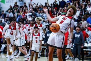 Trent Perry of Harvard-Westlake celebrates after a 63-59 win over Roosevelt. He scored 28 points in the regional final.