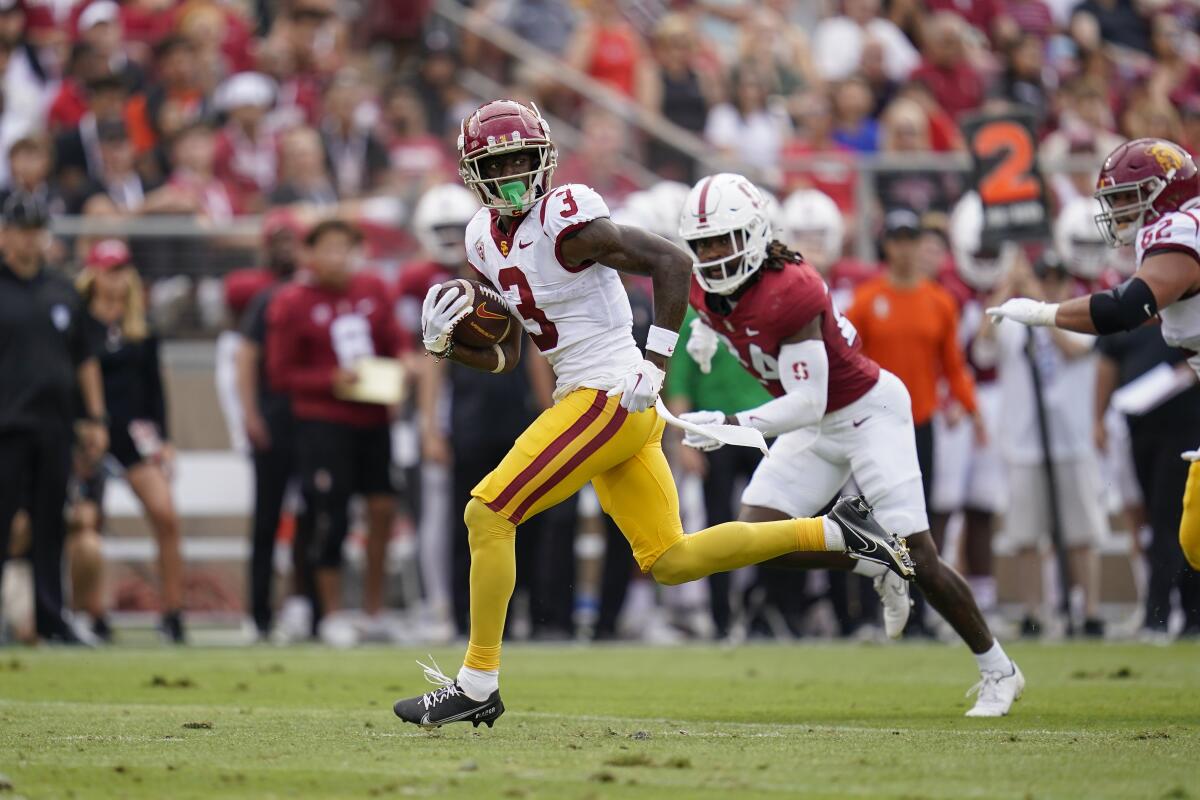 USC wide receiver Jordan Addison runs after catching a pass to score a 22-yard touchdown against Stanford.