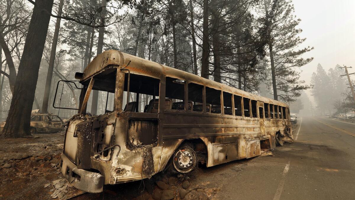 A bus that many people had to abandon to make it out of the Camp fire area, on Skyline Drive in Paradise, Calif.