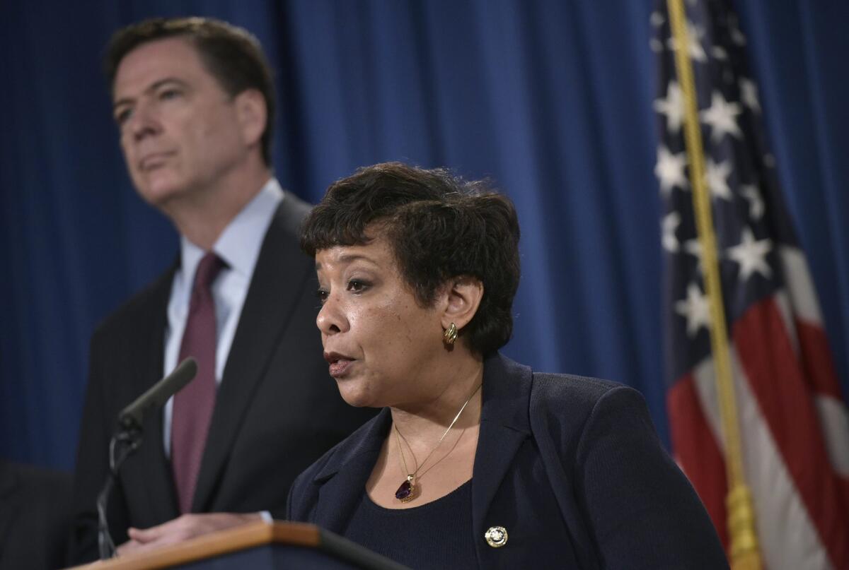 Atty. Gen. Loretta Lynch speaks at a news conference March 24, with FBI Director James Comey, about a cyberattack linked to Iranian hackers.