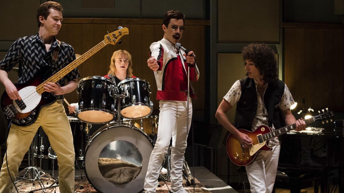 Joe Mazzello, from left, Ben Hardy, Rami Malek and Gwilym Lee in a scene from 20th Century Fox's "Bohemian Rhapsody."