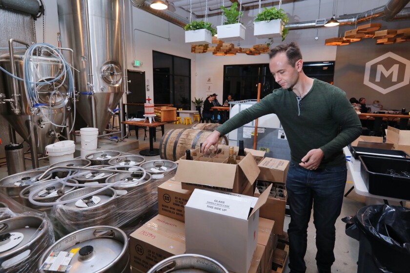 At Meadiocrity meadery in San Marcos, co-owner Mark Oberle works in the company's production area.