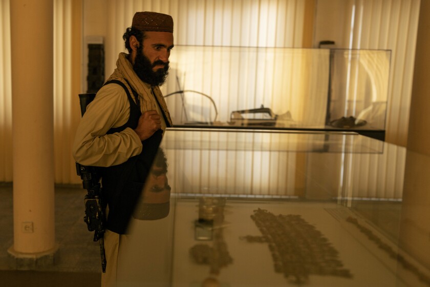 Taliban Fighter Mansoor Zulfiqar, 29, visits the National Museum of Afghanistan, in Kabul, Monday, Dec. 6, 2021. The National Museum of Afghanistan is open once again -- and the Taliban, whose members once smashed their way through the facility, destroying irreplaceable pieces of Afghanistan's national heritage, now appear to be among its most enthusiastic visitors. (AP Photo/Petros Giannakouris)