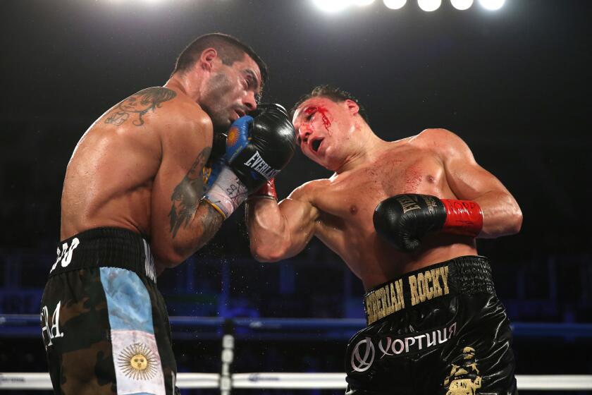 Lucas Matthysse, left, takes an uppercut from Ruslan Provodnikov in an April bout. Matthysse won the 12-round fight.