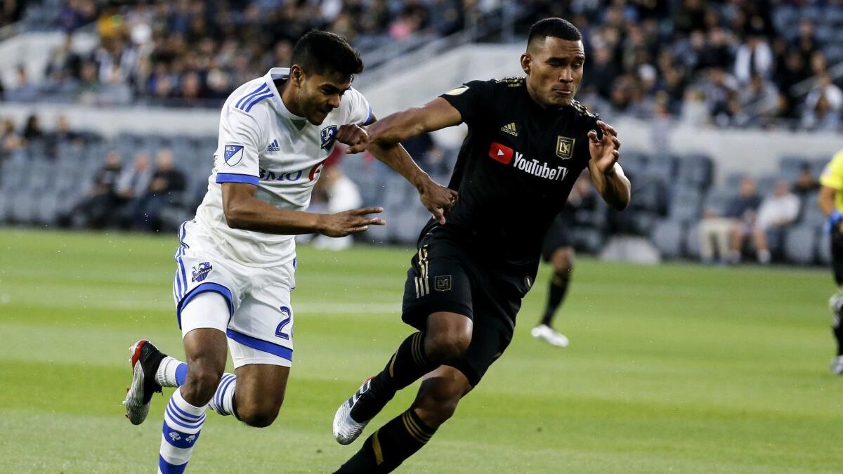 Montreal Impact midfielder Shamit Shome, left, and LAFC defender Eddie Segura chase after the ball during a match on May 24. LAFC will play six games in 21 days starting Friday.