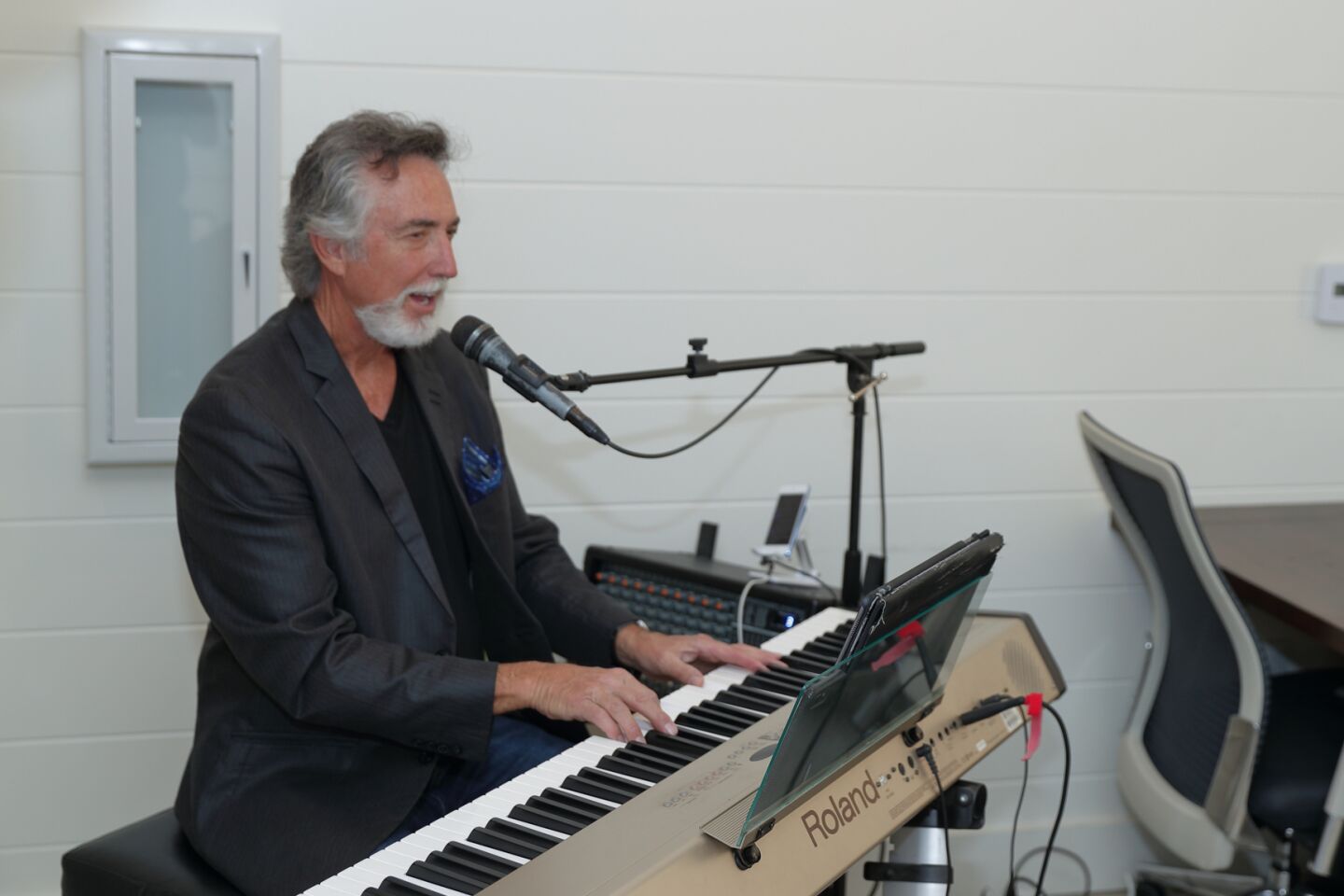 Musical entertainment was provided by Randy Beecher at the grand opening of Eric Iantorno's real estate office in Del Mar Plaza