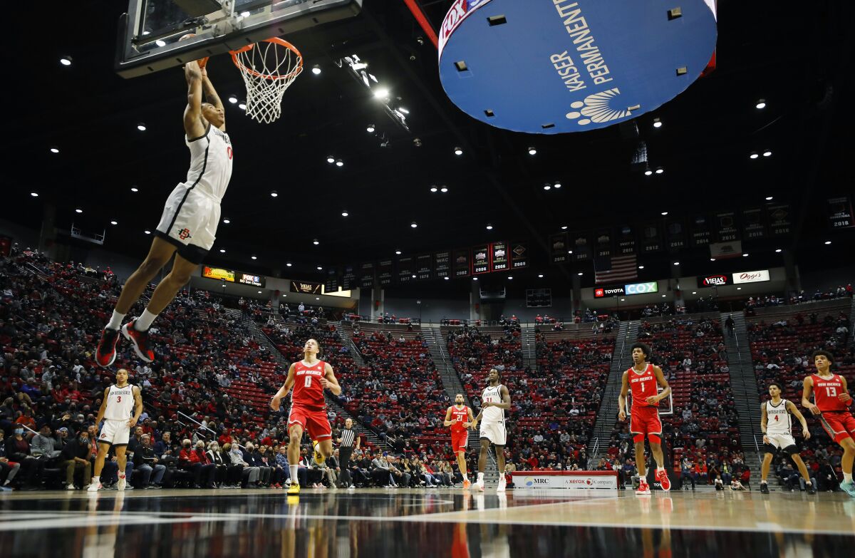 San Diego State’s Keshad Johnson slams the ball on an alley-oop from Trey Pulliam 