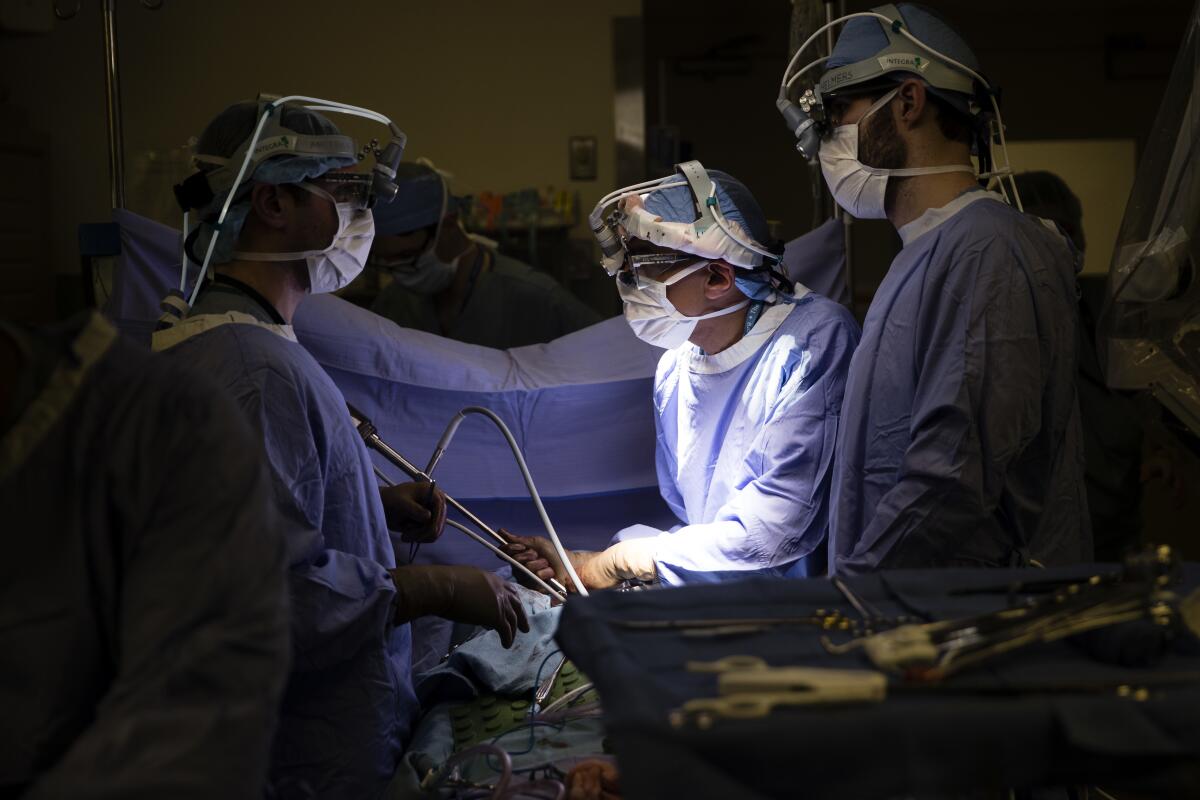 A medical team performs surgery on a cancer patient at a Philadelphia hospital in 2018.