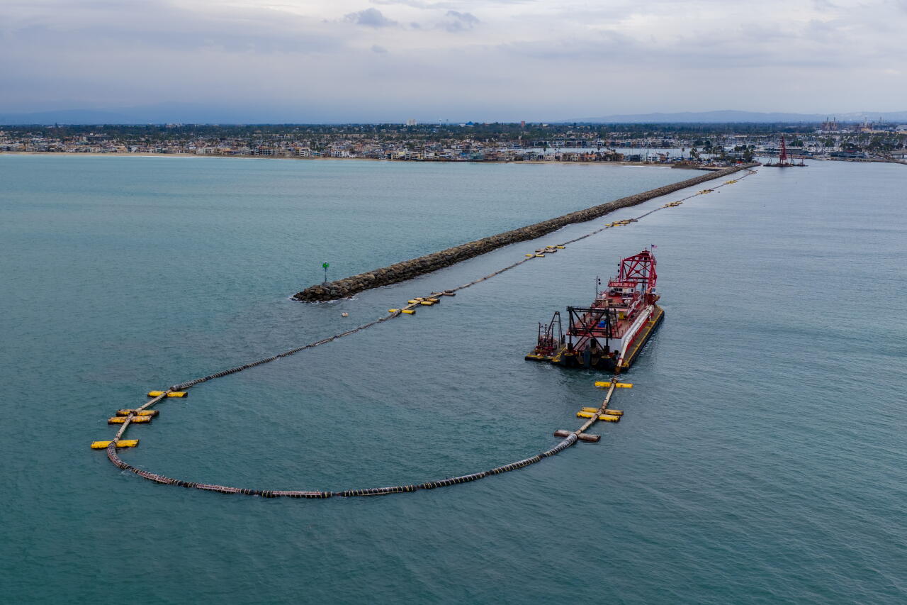 Sand is pumped from the San Gabriel river mouth.