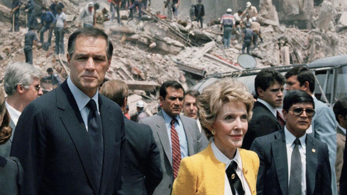 U.S. Ambassador to Mexico John Gavin and first lady Nancy Reagan survey earthquake damage in Mexico City in 1985.
