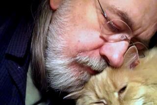 Author Caleb Carr and his cat Masha at his home in Cherry Plain, NY. Carr died of cancer Thursday, May 23, 2024.