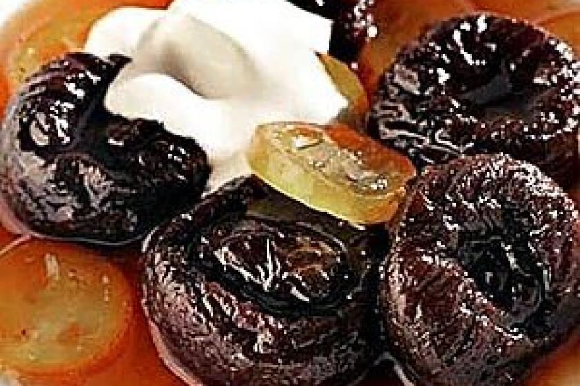 Tangy glazed kumquats perk up a bowl of poached prunes.