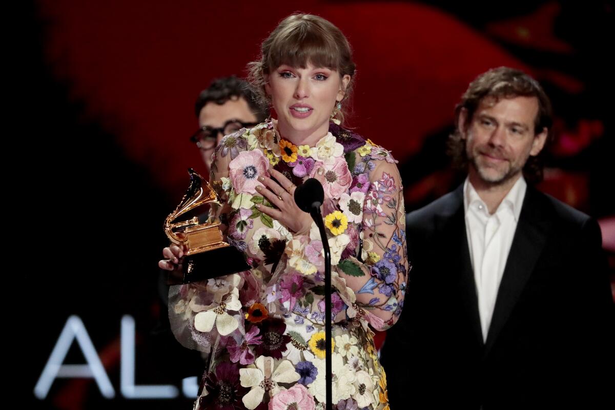 Taylor Swift accepts the award for album of the year. 