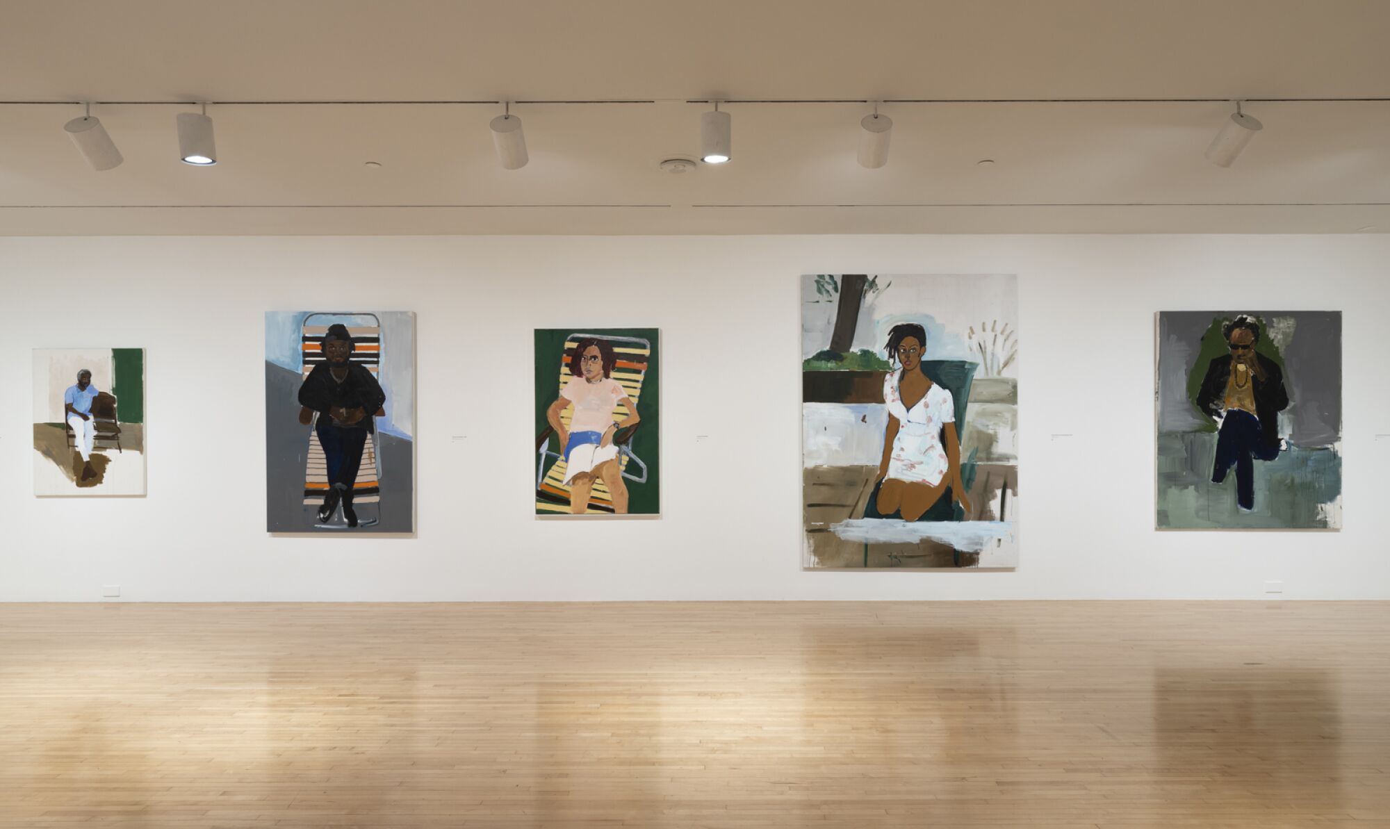 A gallery features five portraits of different sizes and scales, the largest a portrait of photographer Deana Lawson