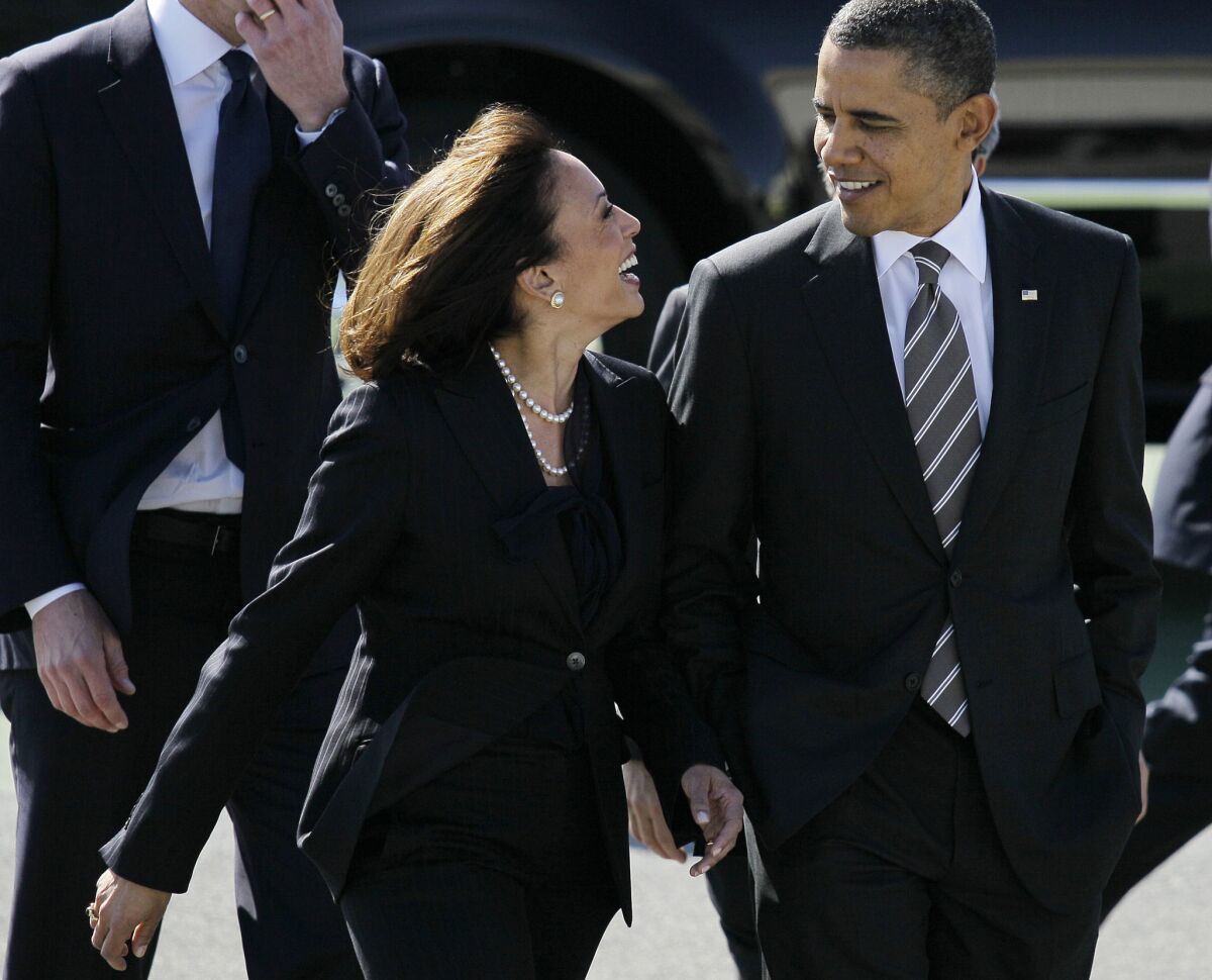 President Obama walks with California Atty. Gen. Kamala Harris in 2012.