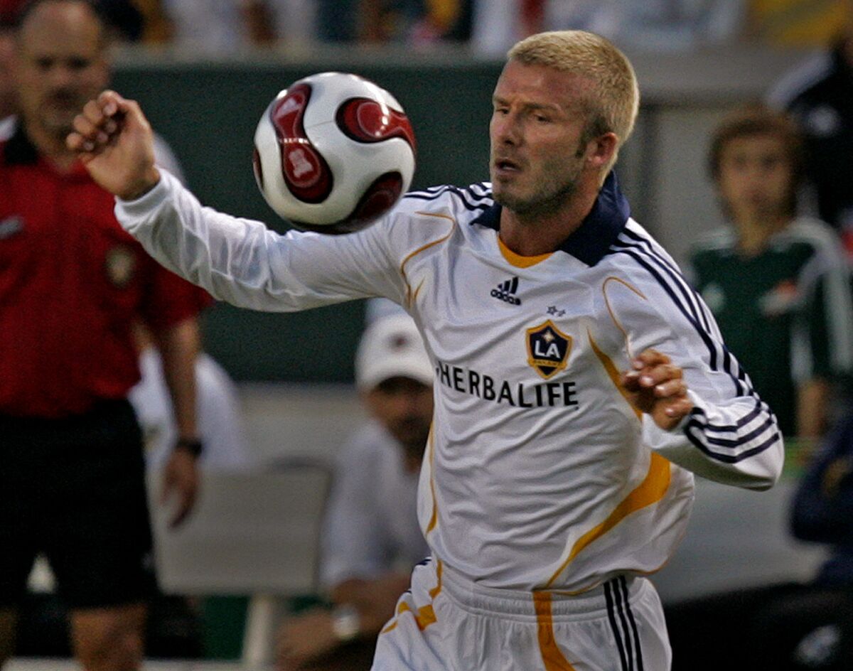 Galaxy star David Beckham keeps an eye on the ball during a match against Chelsea FC on July 21, 2007.